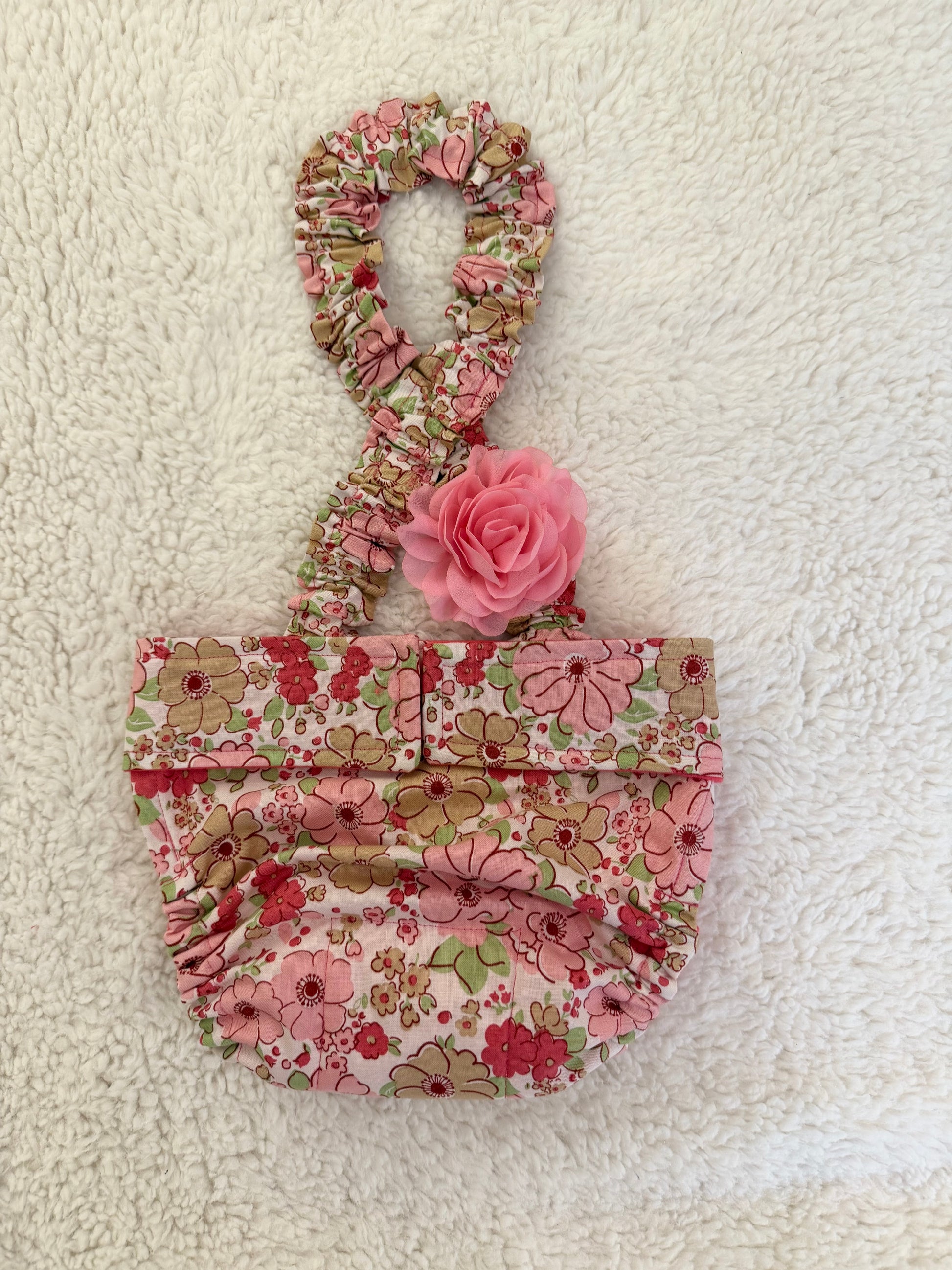 Floral patterned dog diaper with suspenders and flower
