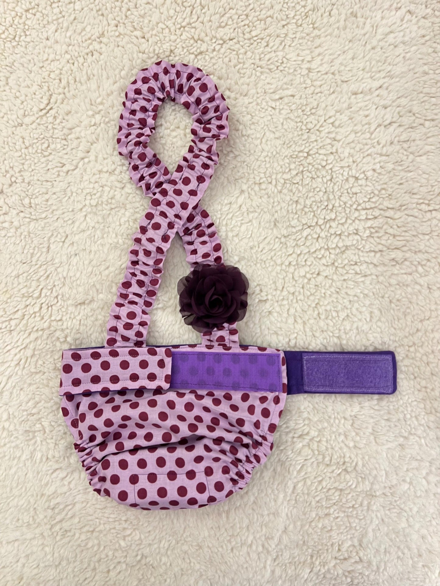 Purple polka dot diaper suspender showing inside